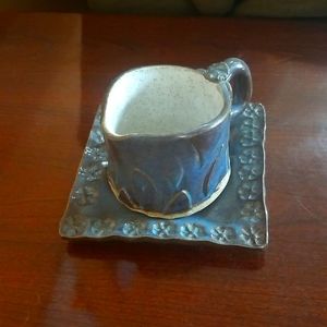 Handcrafted mug and plate set.
